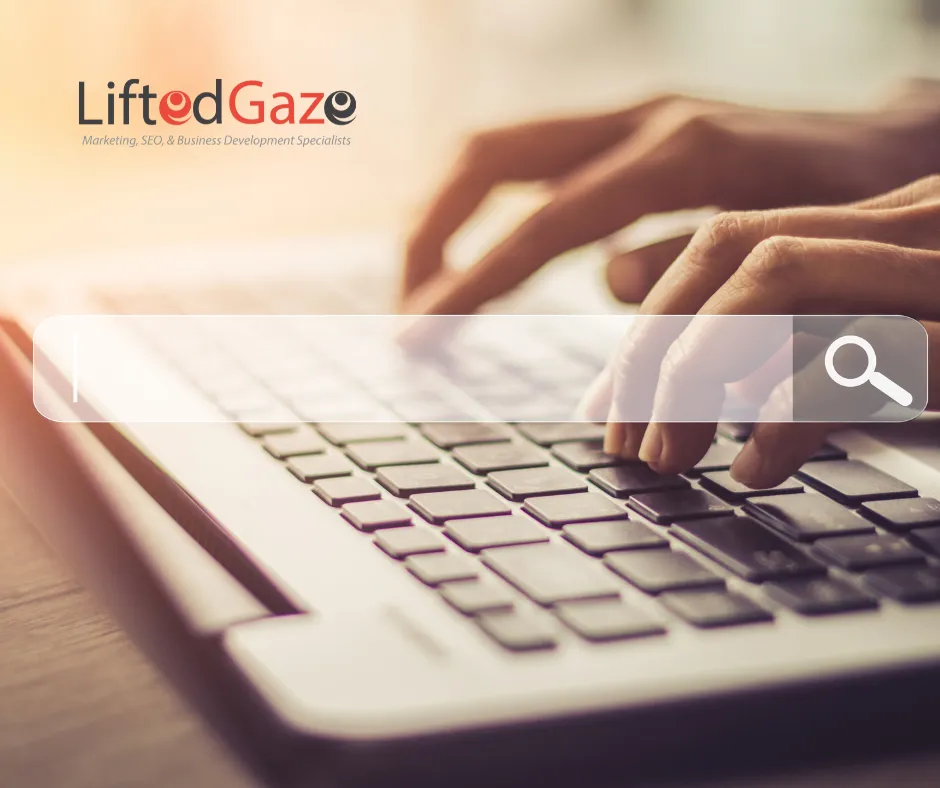 Hands typing on a laptop keyboard.