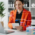 Woman working with laptop and smartphone.
