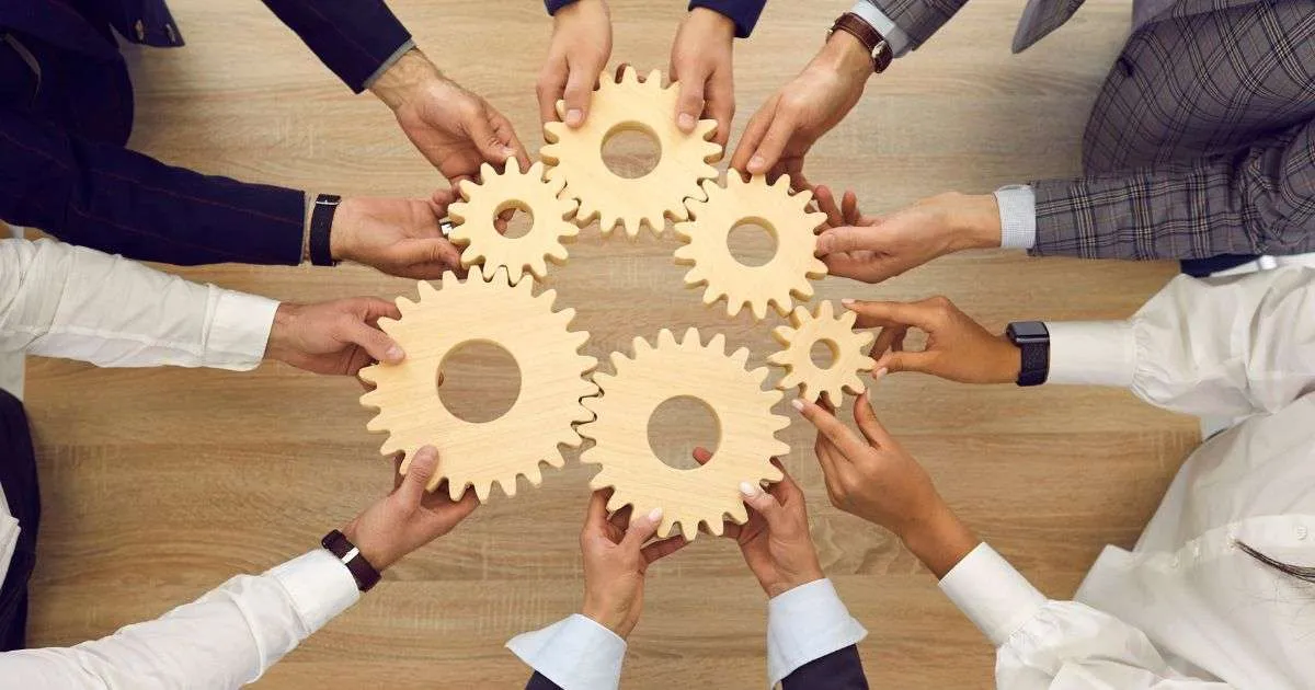 Collaborative teamwork symbolized by interlocking gears.