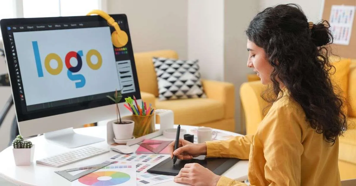 Designer working on logo using graphic tablet.