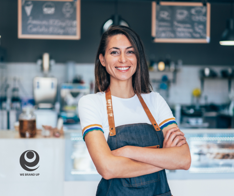 Smiling barista in cafe interior